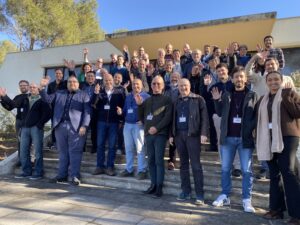 Group photo with all the workshop participants standing on stairs of the Ampere building at Inria Sophia Antipolis